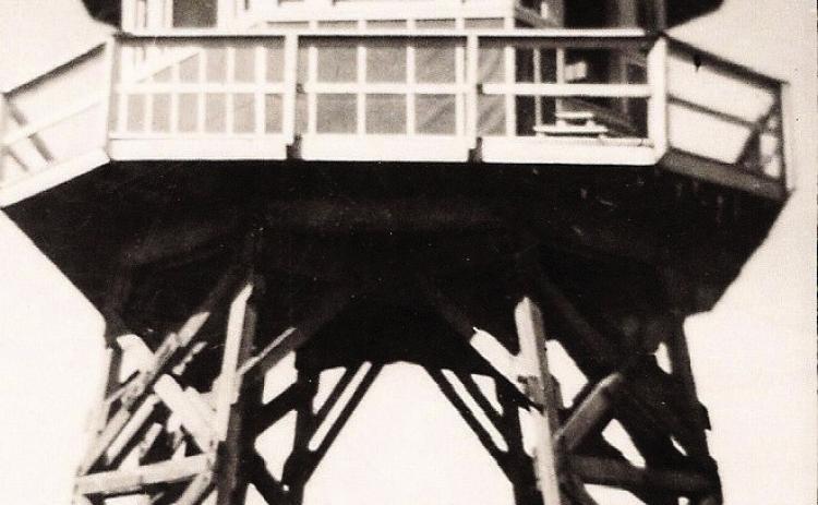 GUARD TOWER—This is a view of one of the 12 guard towers at the Prisoner of War camp just outside of Hereford in Castro County that housed Italian POWs. The jeep beneath the building provides scale.