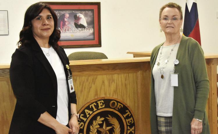 PASSING OF THE GAVEL-It was a changing of the guard at the March 24 as county commissioners voted unanimously to designate Alma Mancinas, left, as acting Justice of the Peace effective April 1 with the retirement of Karen Boren, right, as Justice of the Peace effective March 31. Mrs. Mancinas has worked with Mrs. Boren for 10 years and was unopposed in the March 3 Primary election.