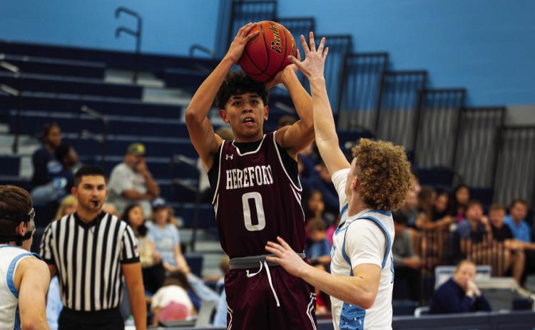 Pierce Valdez (0) plays against West Plains. The Whitefaces lost 72-41 to Estacado in the Caprock Tournament Monday. Both the Lady Herd and the Hostile Herd host Pampa Jan. 6 in district play.