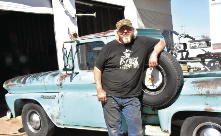 STILL ROAD WORTHY--Mike Harrell and his classic 1960 Chevy pickup are both still road worthy and will likely share some traveling adventures after Harrell closes a local institution--Mike's Auto Repair at the end of April. He rebuilt the pickup's motor and added an air conditioner that he installed himself. He's already driven the rig as far as Houston and back. (Photo by Jim Steiert)